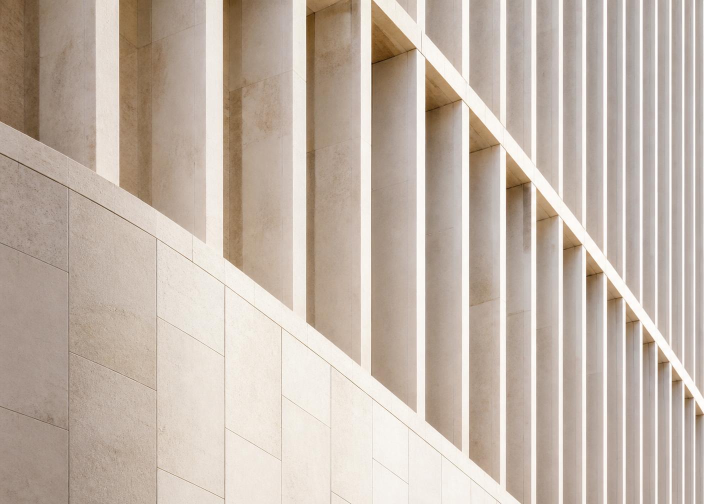 Stone facade detail in raking daylight